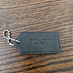 Black Woth Dark Brown Edge Coach Tag. (Bin14)